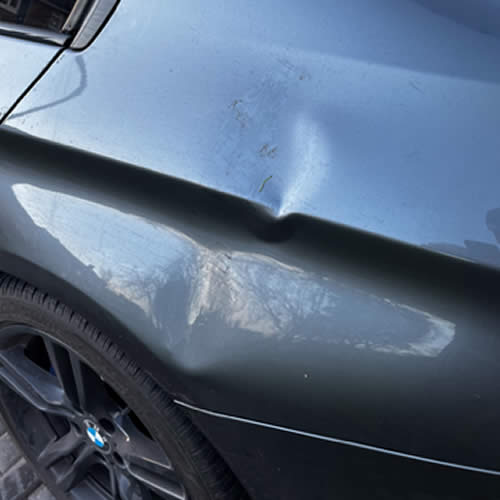 Deep dent on BMW 5 Series Quarter Panel - Before Deep dent on BMW 5 Series Quarter Panel - Before