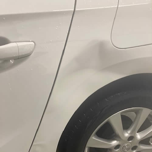Deep dent on Vauxhall Corsa Quarter Panel - Before
