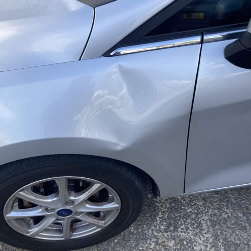 Deep crease on Ford Fiesta Wing - Before Deep crease on Ford Fiesta Wing - Before
