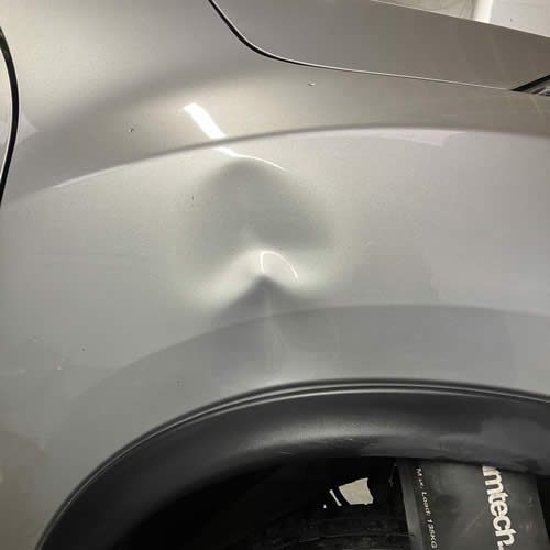 Car panel before PDR - Nissan Juke Wing Dent Car panel before PDR - Nissan Juke Wing Dent